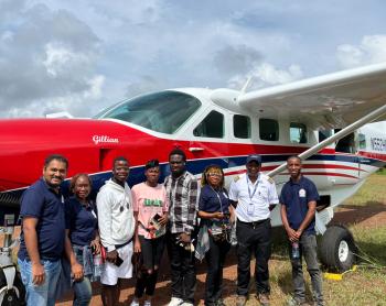Trinity Dental Clinic team outside an MAF plane