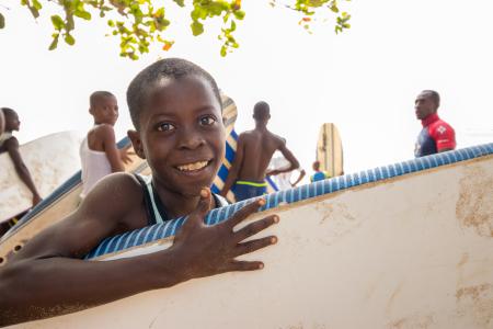 Graduate with a surf board