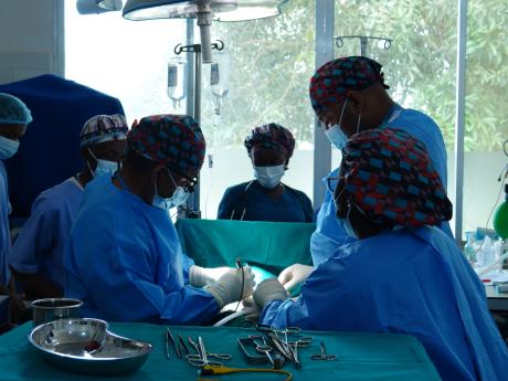 Dr. Gerald Ekwen-and his surgical team in the operation room