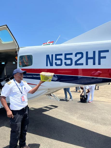 A pilot with a small container