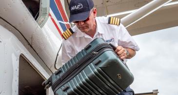 pilot holding luggage 
